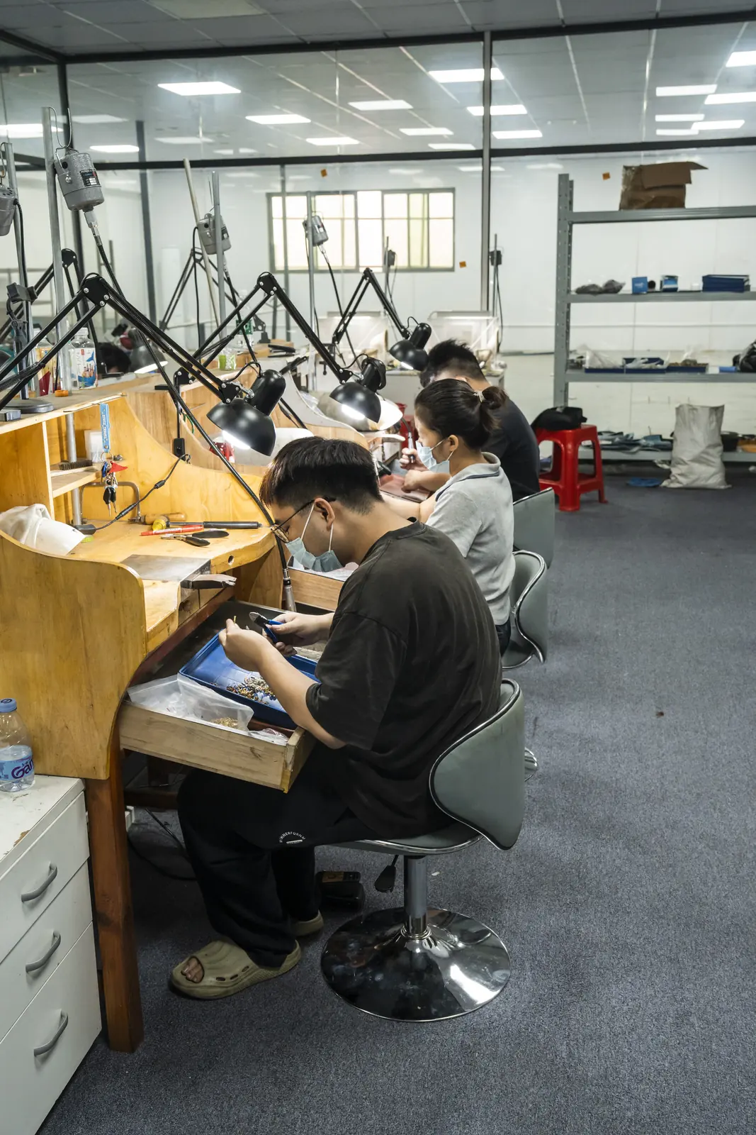 ORNOVAI craftspeople at individual hand-finishing workstations